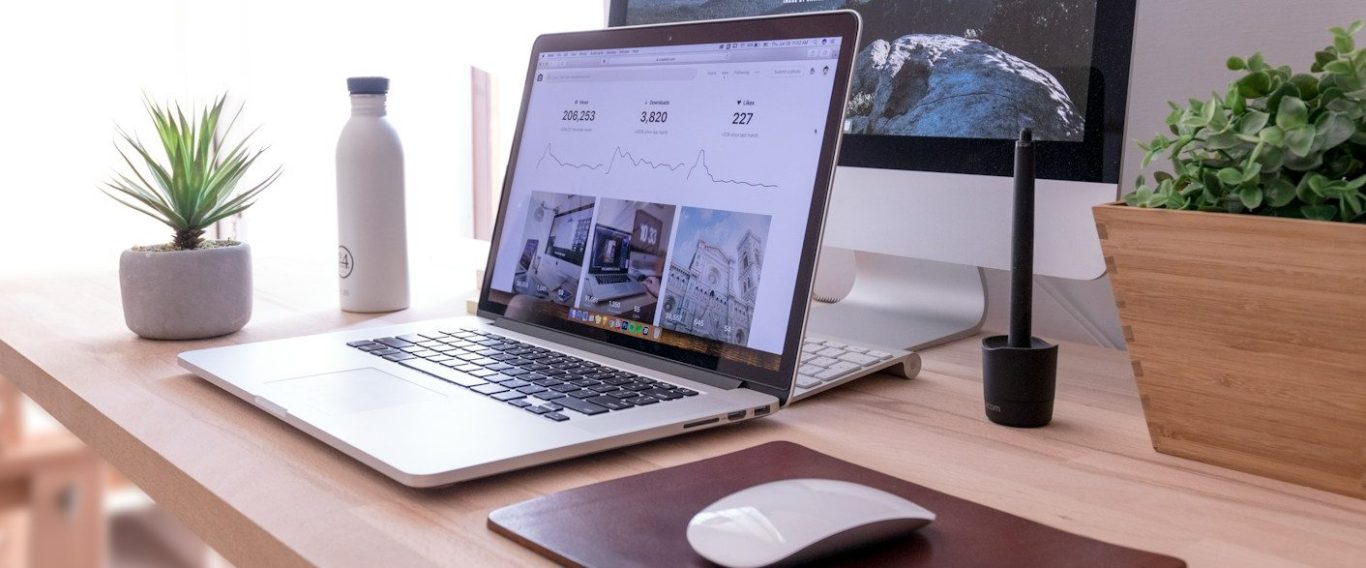 Lynda Stone Bookkeeping header image. Laptop displaying charts on desk. Used for bookkeeping services for businesses and sole traders.